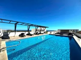 Bahia del Tezal 103b Modern 1BR Retreat with Rooftop Pool & Beach Access