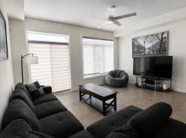 Modern 2 Bedroom Smart Home with Free Parking, Full Kitchen, Laundry & Private Backyard - Steps to Shops & Restaurants, 6 Mins to Innisfil Beach Park - Perfect for Families & Couples!