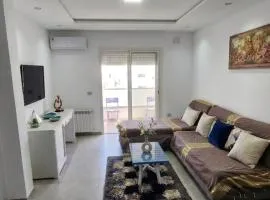 two-bedroom apartment with a living room, kitchen and balcony