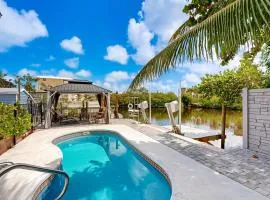 Key West style waterfront home with private pool, modern decor and prime location