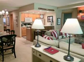 2BR ski-in/ski-out condo with fireplace, patio, and full kitchen