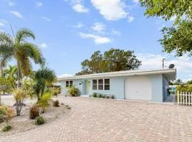 Single-level waterfront home with furnished Florida room, dock, washer dryer