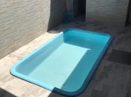 Linda e aconchegante casa na Praia com piscina, churrasqueira e garagem privativa!