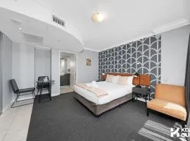 KozyGuru | CBD Queen Bed Studio Cozy & Convenient