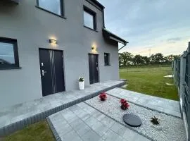Half of a holiday home with a large garden
