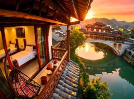 Huaqianshu Theme Inn 高铁免费接站或送站一次 โรงแรมในWangcun
