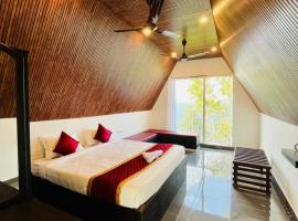 Oxygen Rain Forest Resort, готель у місті Kūmudi
