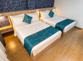 Kuadro Hotel & Suites, מלון במואלבואל