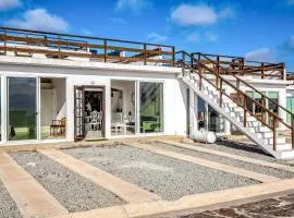 Dog-Friendly Oceanfront Villa with Rooftop Patio, Pool Access, & Kitchen