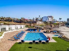 Dog-Friendly Beachfront Retreat with Rooftop Deck, Pool, Hot Tub, & Kitchen