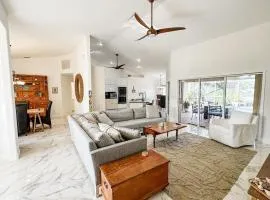 Modern 3-bedroom waterfront pool home in Manatee Bay with boat slip included