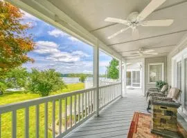 Lakefront retreat with a large yard, stone fire pit, gazebo, deck, & dock