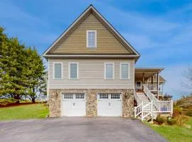 Nature lover's lakefront home with a beach, dock, fire ring, & more