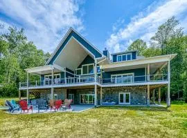 Dog-friendly lakefront home with a game room, children's items, and firepit