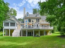 Lakefront home with private beach, dock, deck, kayaks, game room, & fireplace