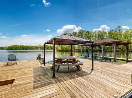 Lakefront home with two kitchens, a dock, firepit, & pontoon