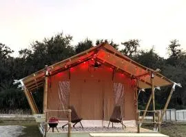 Glamping Safari Tent with Fire Pit & Relaxing Hammocks in Basinger, Florida