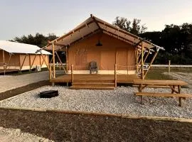 Double Deluxe Safari Tent with Fire Pit and Hammocks in Basinger, Florida