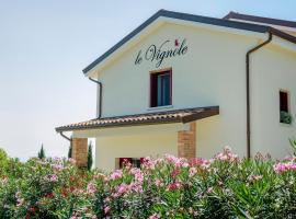 Alloggi Agrituristici Le Vignole，Cordignano的有停車位的飯店