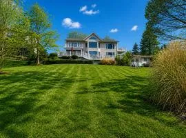 Lakefront retreat with views, hot tub, kid's play area, dock & fiber internet