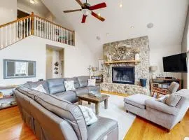 Nature lover's lakefront home with a beach, dock, fire ring, & more