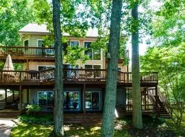 Spacious lake lodge with a private dock, wraparound decks & foosball