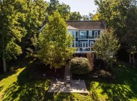 Lakefront home with private hot tub, WiFi, fun rec room, & beach area