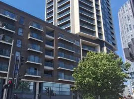 ENTIRE APPT! Seconds from ABBA Arena, Westfield & Olympic Park! King Bed, Living room, Kitchen & Bathroom! Balcony View!