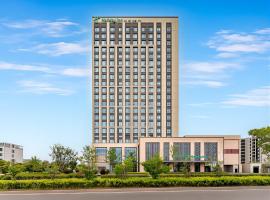 Holiday Inn Qidong Lvsi Port, хотел в Qidong