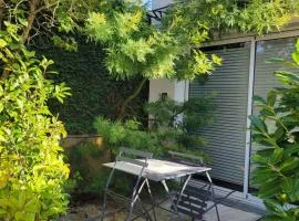 Studio cosy Climatisation, terrasse privée, parking devant la maison