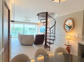 Escale élégante à la mer Duplex neuf en front de mer