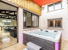 Charmant atelier climatisé avec jacuzzi et parking privé