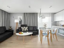 Przytulne i Nowoczesne Apartamenty Sun Seasons 24 w Dziwnowie z Parkingiem by Noclegi Renters