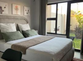 Ekuku Snug โรงแรมในOshakati