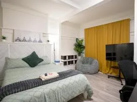 Spacious Room with Large TV & Standing Desk