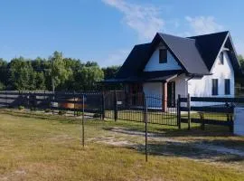 Całoroczny dom wypoczynkowy pod Lasem z prywatnym jaccuzii