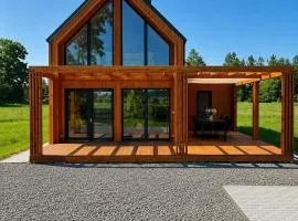 Polesie slow life, bez sąsiadów , nowoczesny domek z tarasem w pobliżu jezior i Poleskiego Parku Narodowego , sauna , jacuzzi, WiFi
