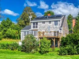 Elegant home right in town with gorgeous water view, deck & interior