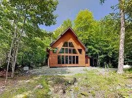 2 beautifully designed, off-the-grid homes with amazing lakefront views & access