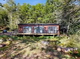 Modern Maine cottage with river views, deck, and a convenient washer/dryer