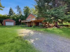 Scenic retreat with a spacious deck, gas fireplace, and Moosehead Lake views
