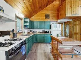 Scenic retreat with a spacious deck, gas fireplace, and Moosehead Lake views