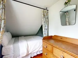 All-suite Boothbay Harbor home with deck, ocean views, and fireplaces