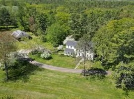 Renovated farmhouse on an acreage with grill, four-bedrooms, & W/D - river views