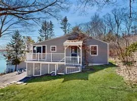 Dog-friendly river-view home with wood stove, deck, patio, dock, beach, grill