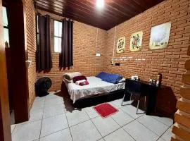 Quarto com banheiro privativo no Centro