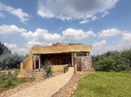 Gahinga Community Lodge, хотел в Kinigi