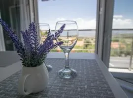 Sunny Home Loutraki is a modern studio with views of the bay and mountains with private parking