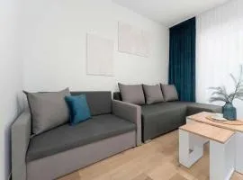Cozy Studio with a Balcony and Parking by Noclegi Renters
