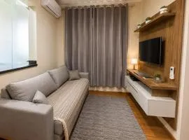 Apê 5min do centro | 2 quartos, ar e garagem